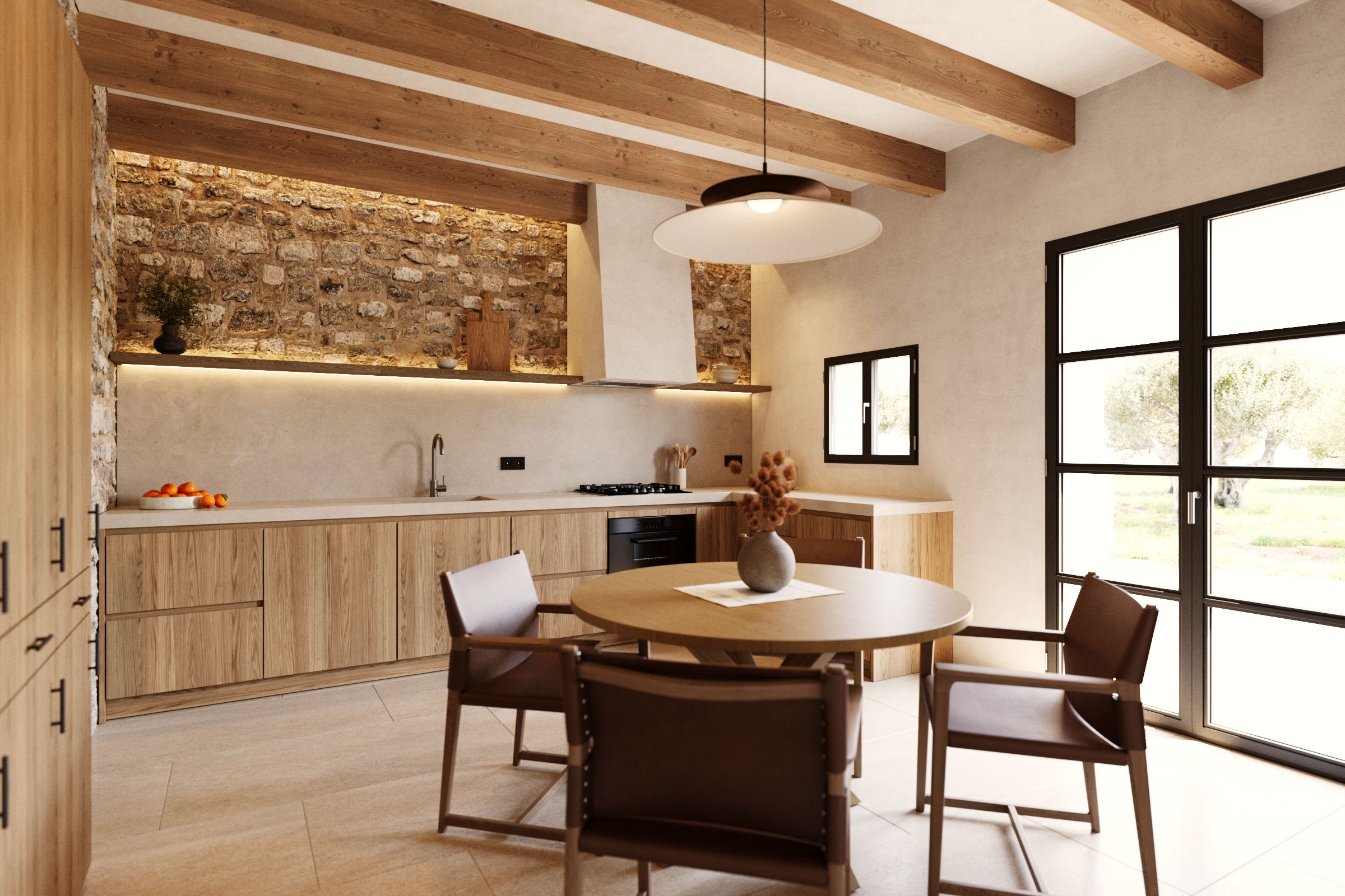 Cocina con mesa redonda y sillas de Zara Home diseñadas por Vincent Van Duysen en una casa rústica en Manacor, Mallorca