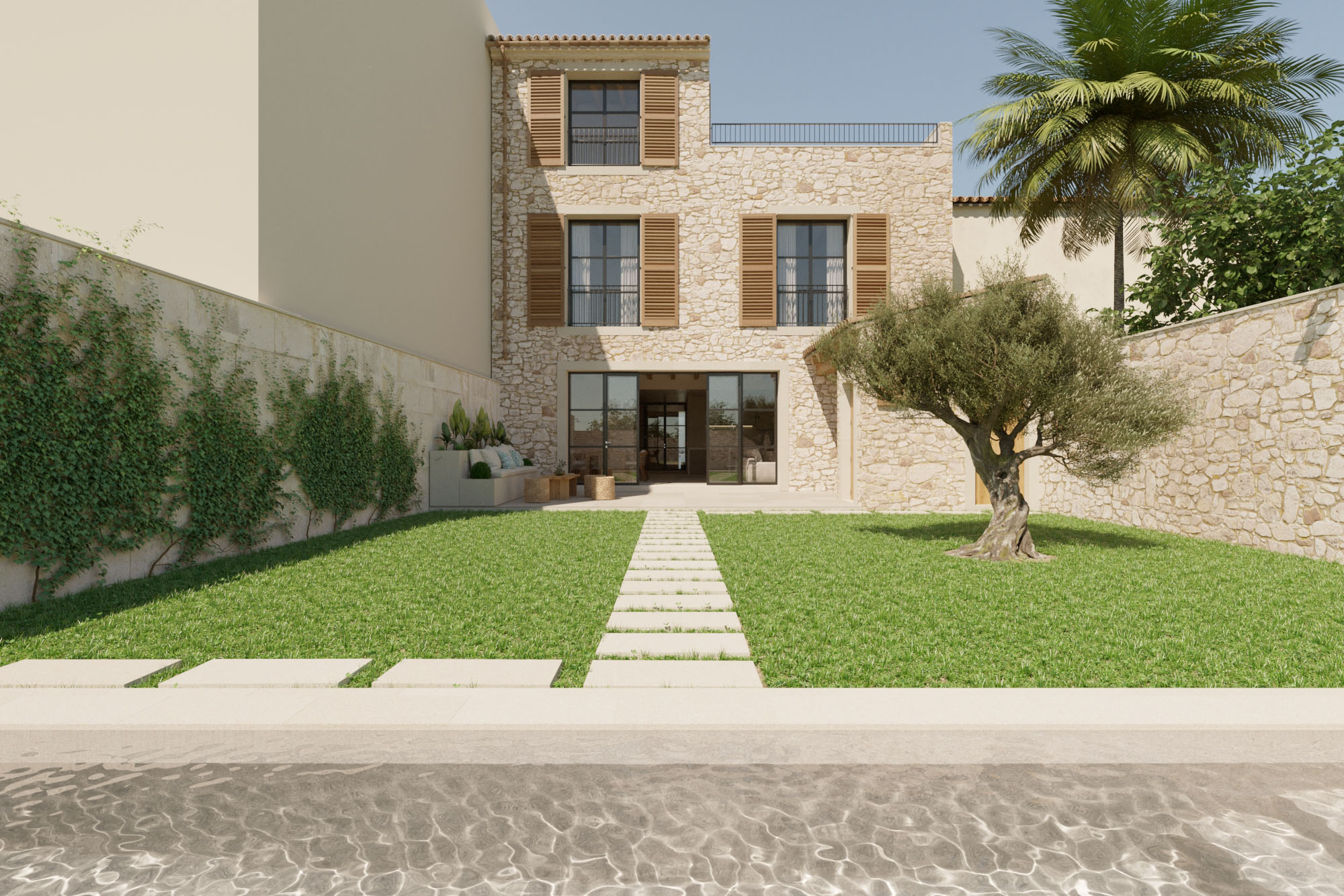 Patio interior con jardín y piscina en una casa de pueblo en Santanyí, Mallorca.
